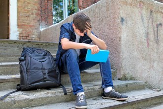 Teen stressed on the steps