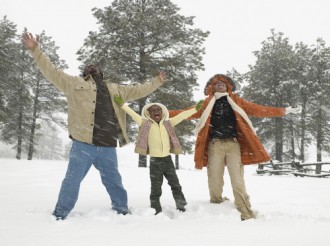 Black Family having fun in the snow
