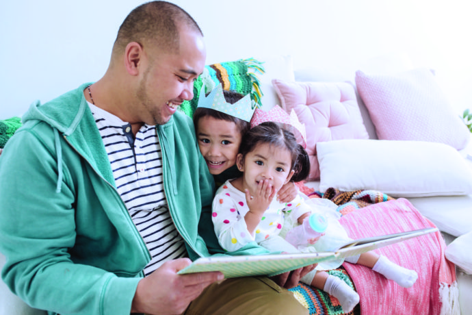 father reading to children