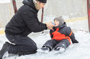 Asthma, Allergies flare ups: A family playing at the skating rink in winter.