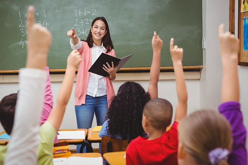 Teacher asking her students a question | Our Children