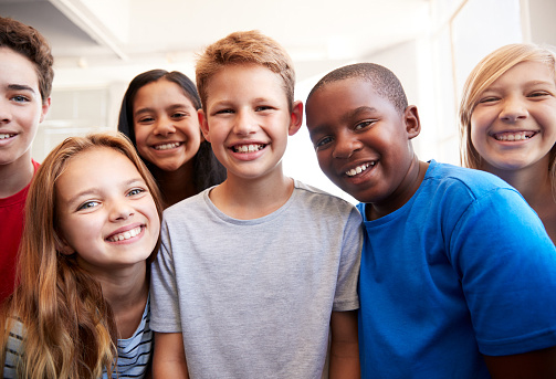 Portrait Of Smiling Male And Female Students In Middle School