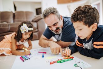 Building Social Emotional Skills: Latino family enjoys weekend together with grandparents and children.