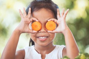 Children's Eye Health - Healthy Cute Asian child girl having fun to learn about vegetables with happiness