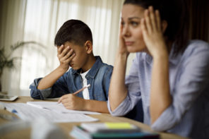 Stressful School Projects: Teenage boy having problems in finishing homework