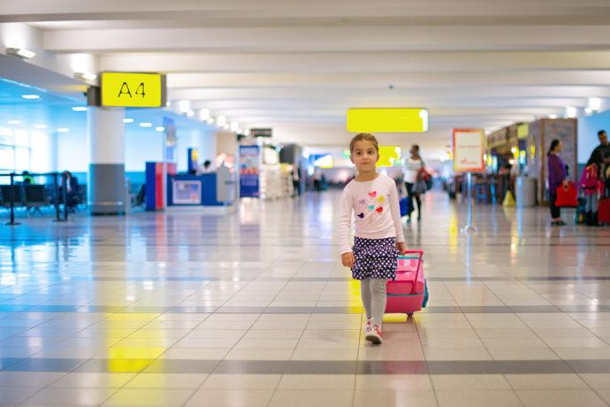 Child walking through an airport