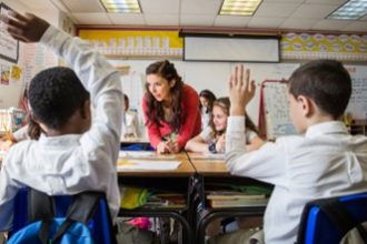 Teacher talking to students