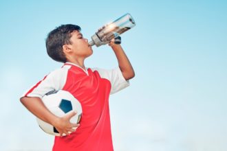 Boy drinking water.