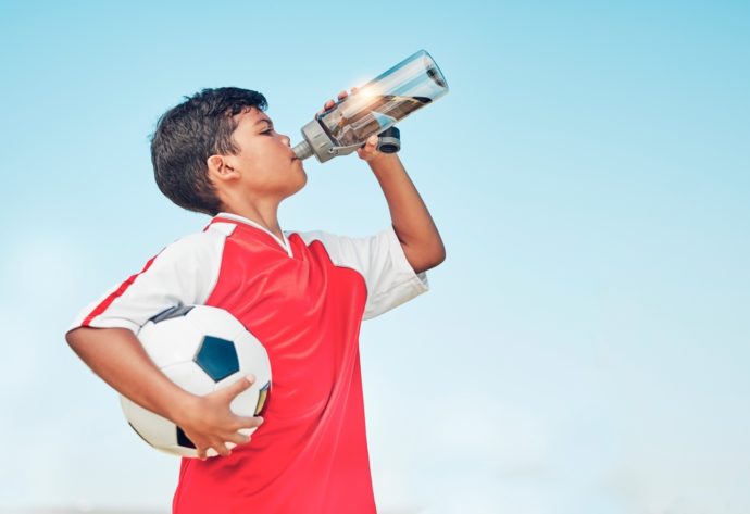 Boy drinking water.