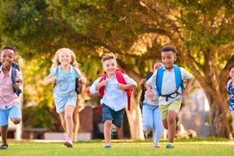 Students running with backpacks