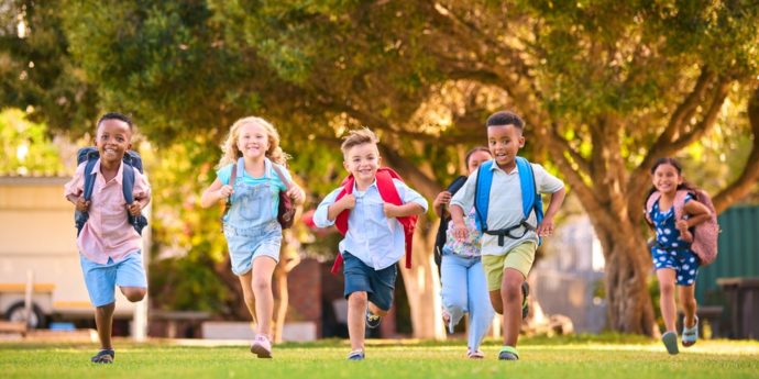 Students running with backpacks