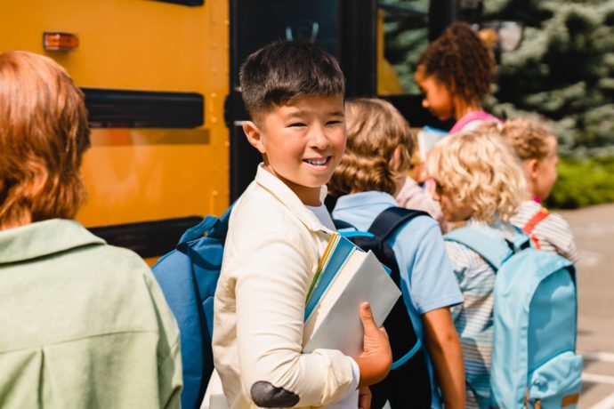 Child boarding a school bus