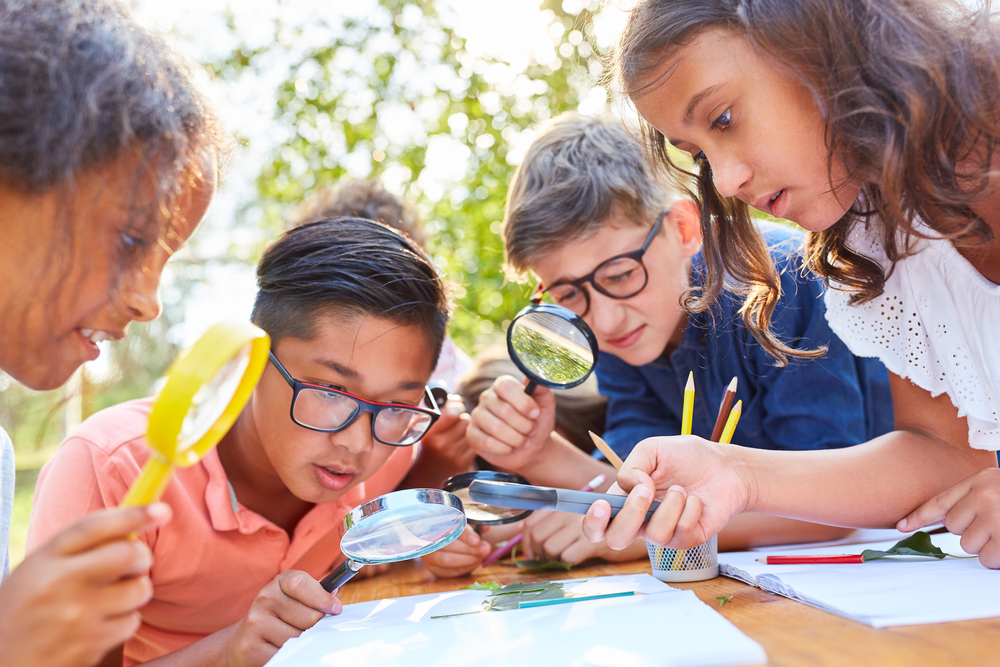 Kids with magnifying glasses