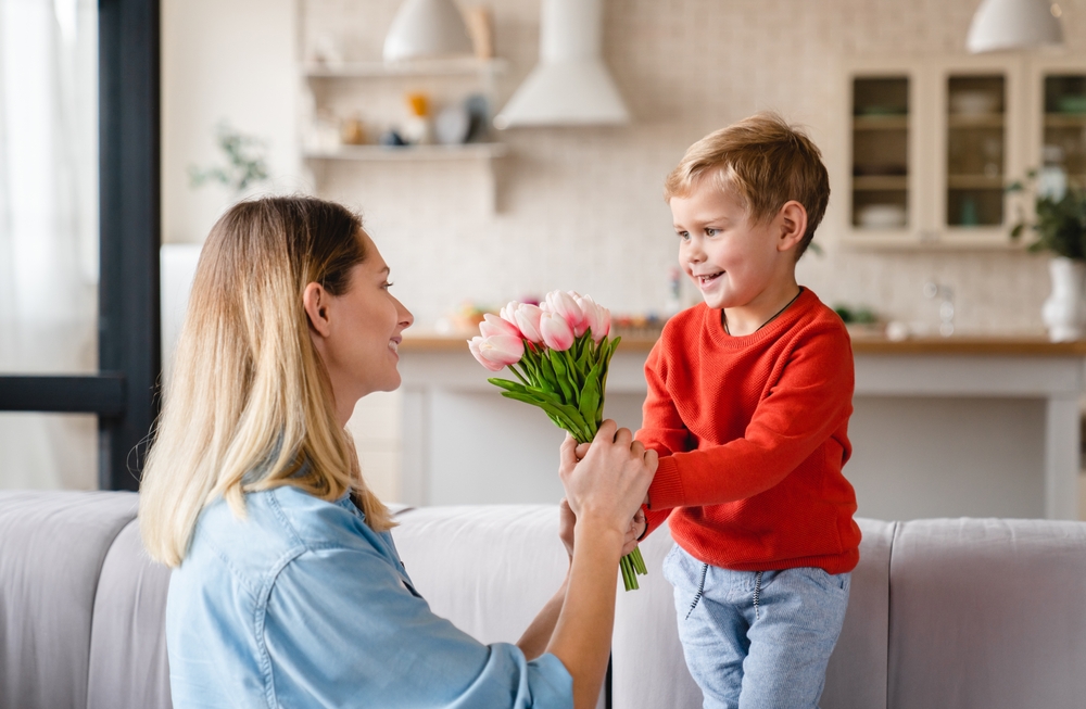 Child Giving Mom Flowers