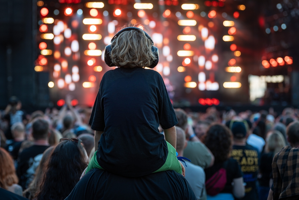Child at a concert with headphones